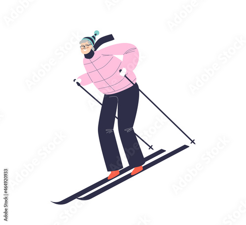 Woman skiing. Female riding ski downhill enjoying winter resort, holidays and outdoor activities