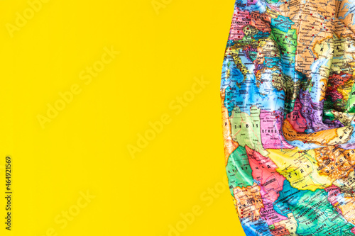 Top view part of the world map, European countries, African countries on a yellow background. Flat lay. Copy space. World map Russian language