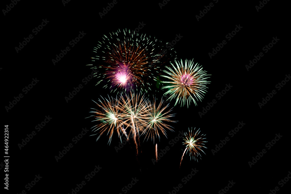 Many flashing colorful fireworks in event amazing with black background celebrate New Year, holiday and festival in night.