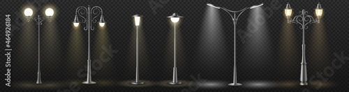 Modern and vintage city street lights row working at night. Urban electrical lightning system
