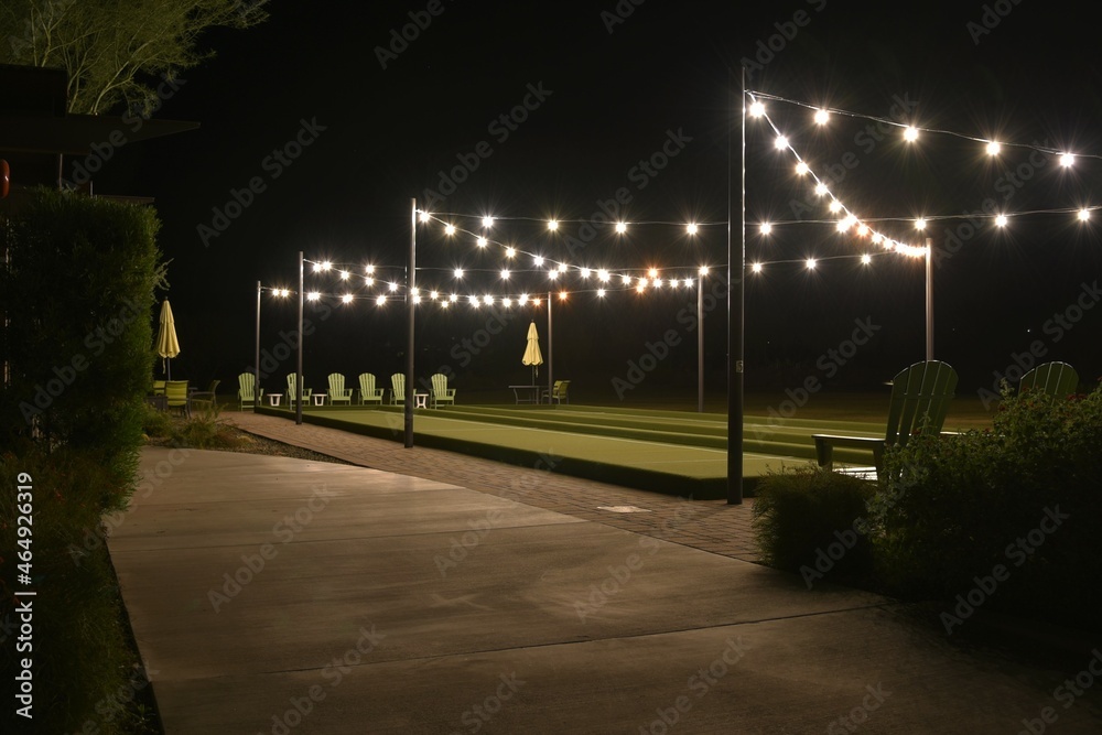 Bocce ball court lit up at night