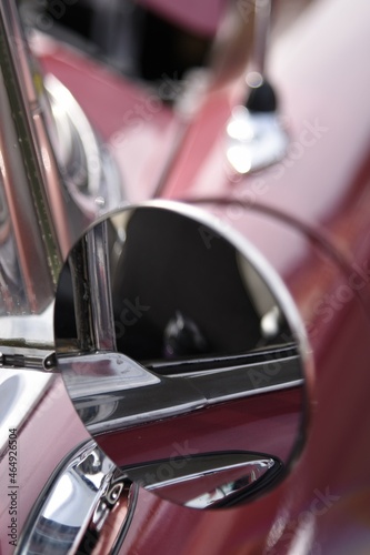 Round mirror on a vintage car