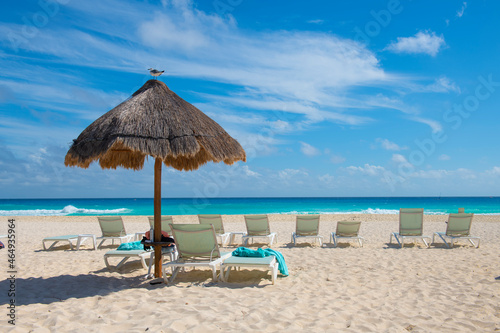 Cancun Beach with sun umbrellas in a sunny day, Cancun, Quintana Roo QR, Mexico.