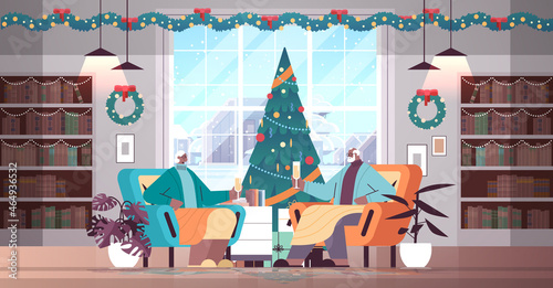 african american grandparents in santa hats drinking champagne senior people celebrating new year christmas holidays