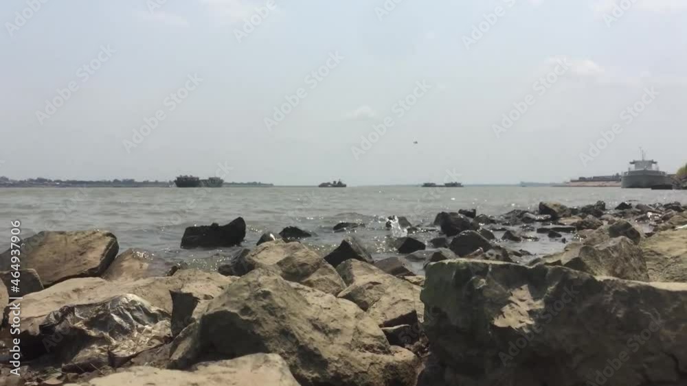 Waves hit the brown-orange rocks of the shore with their clear turquoise water turning to white foam.
Waves hit the brown-orange rocks of the shore with their clear turquoise water turning to white foam.