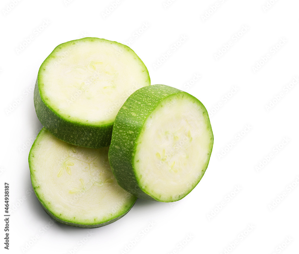 Ripe zucchini slices isolated on white background. Fresh vegetables. Ripe zucchini slices isolated on white background. Fresh vegetables.