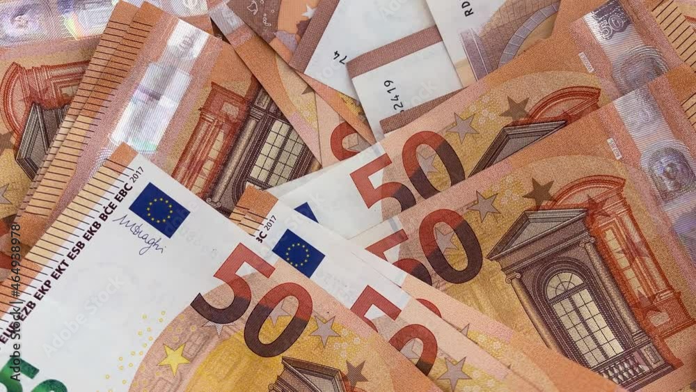 4k 50 euro bills background. A lot of 50 euro banknotes in motion.