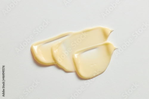 yellow cream wave in white background for cosmetic advertising photo