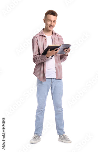 Young man reading Holy Bibl...