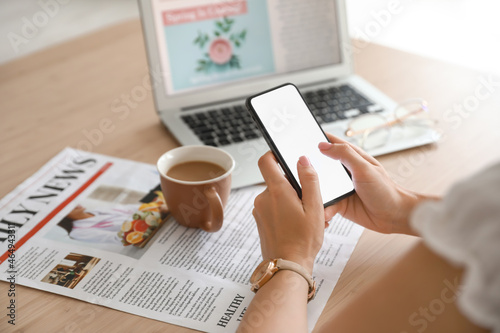 Woman using mobile phone on...