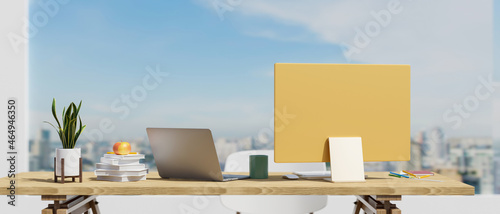 Close-up Business executive working desk in office over city building and sky view in background.