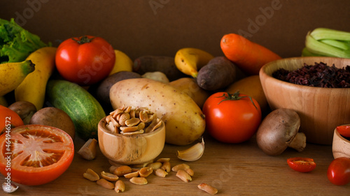 Fototapeta Naklejka Na Ścianę i Meble -  vegetables, seeds, nuts, rice berry, fruits on wooden table. vegan, plant-based, organic.