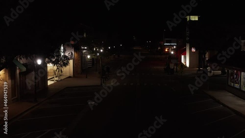 Aerial view of Joliet Prison street in Naperville, Illinois. Drone moving forward over a empty road at night in Naperville. No people on the street. photo