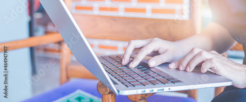 Obraz na płótnie Business woman hand using laptop computer in the office.for web banner. w salonie