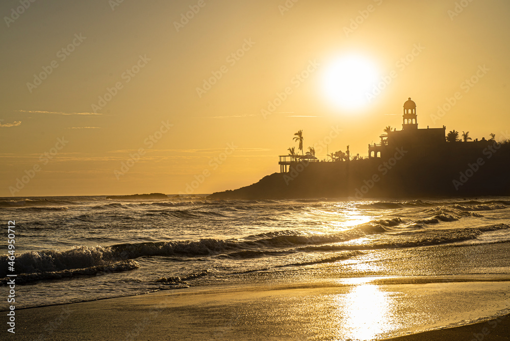 Golden hour on the beach, summer sunset in Los Cerritos Beach, with the silhouette of the waves and the mountain near the beach, La Paz Baja California Sur, Todos Santos. Mexico