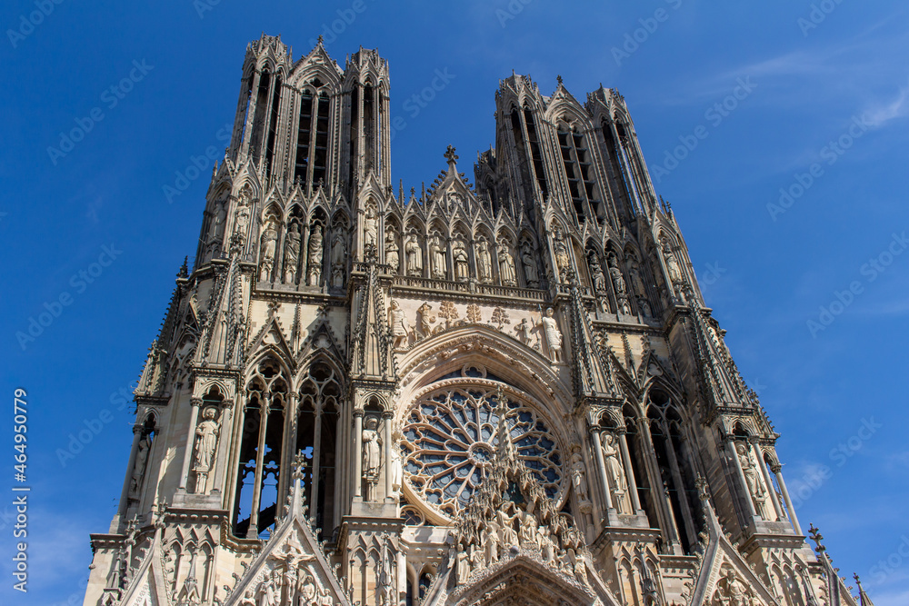 Fototapeta premium Close up view of the ornate medieval Our Lady of Reims Cathedral (Notre-Dame de Reims) in France, with high Gothic architecture, showing its central rose window