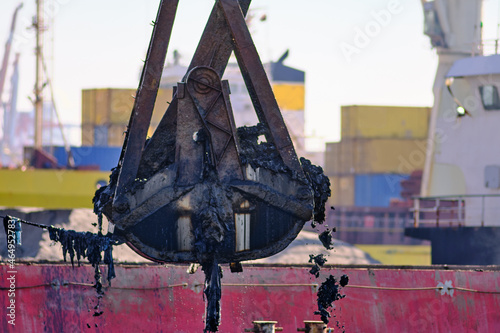 Clean the environment- a clamshell of a dredging ship removed silt and other materials from the bottom of the sea. These deposits have accumulated on the seabed over time.