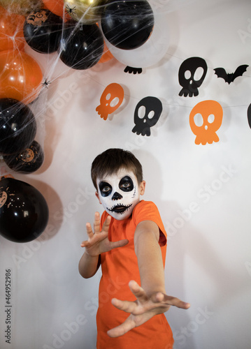 Halloween celebration concept. The boy in spooky make-up.