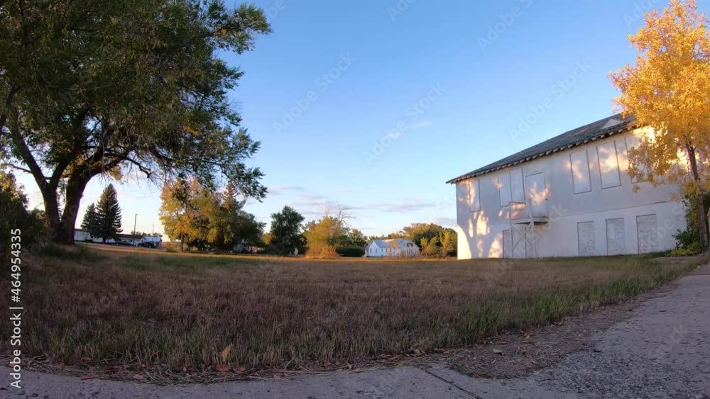 TIMELAPSE - An old abandoned hospital in a small town on a sunny day. TIMELAPSE - An old abandoned hospital in a small town on a sunny day.
