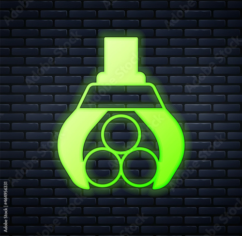 Glowing neon Grapple crane grabbed a log icon isolated on brick wall background. Forest industry. Industrial crane for lumber trunk wood production. Vector