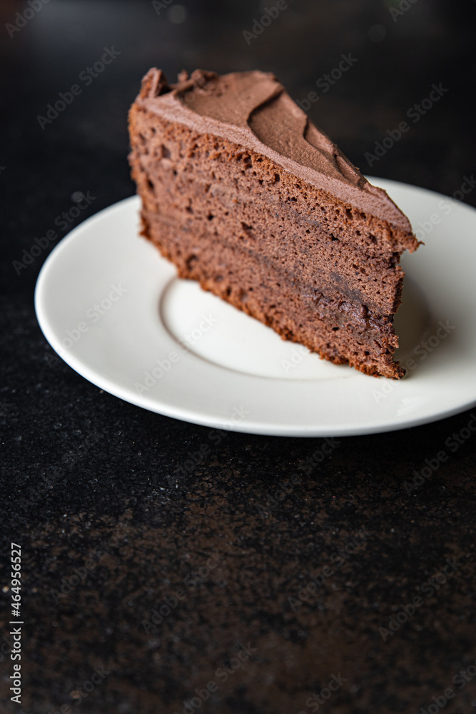 piece of chocolate cake cocoa sponge cake, chocolate ganache, brown cream sweet dessert ready to eat meal snack on the table copy space food background rustic. top view piece of chocolate cake cocoa sponge cake, chocolate ganache, brown cream sweet dessert ready to eat meal snack on the table copy space food background rustic. top view