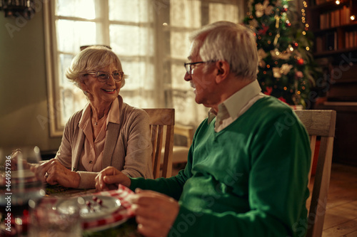 Senior couple having dinner together on Christmas eve at home