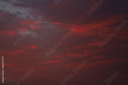 dramatic clouds in crimson color during sunrise © albert