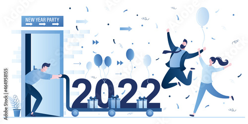 Young adults celebrating new 2022 year. Businessman rolls up cart with numbers and gifts. Colleagues celebrating. Happy people on new year party event.
