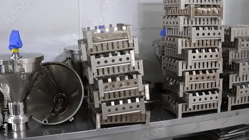 Sterile medical supplies. Metal containers. Metal trays, boxes and hoppers on table.