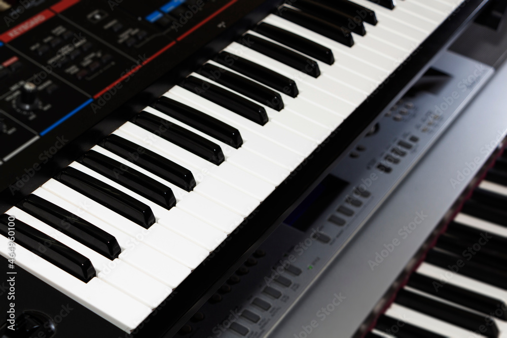 Electronic musical keyboard synthesizer close-up, musical instrument, piano. Electronic musical keyboard synthesizer close-up, musical instrument, piano.