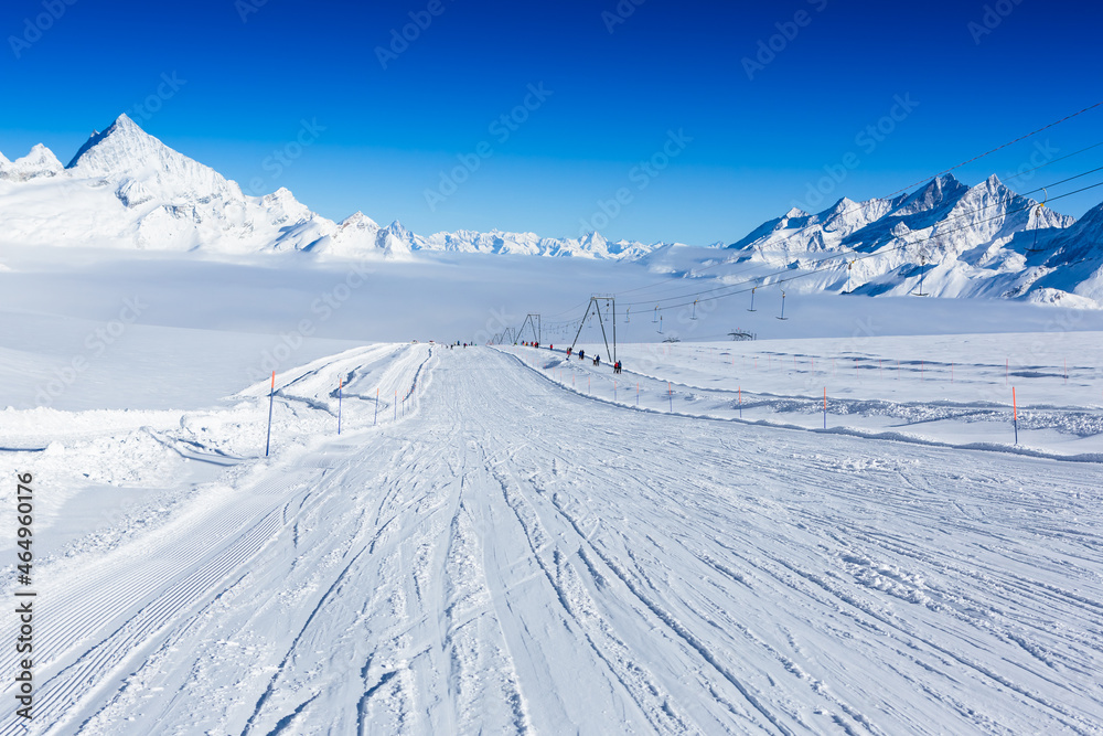 Winter mountains, panorama - snowcapped peaks of the Italian Alps and ski slopes