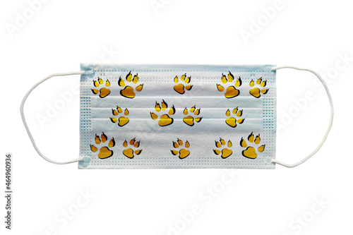 Blue medical mask with a tiger pattern on a white background close-up.