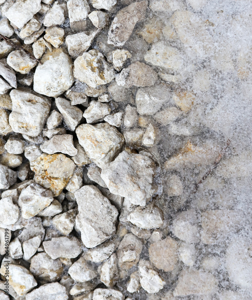 Fototapeta premium Gravel on the ground in ice