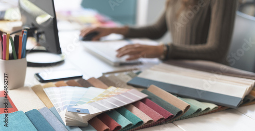 Designer working with her computer in her studio