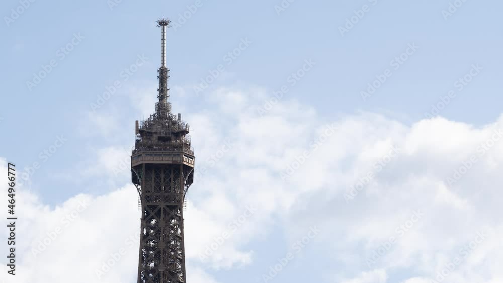 Eiffel Tower Highest Part at daytime - Timelapse with clouds moving fast in the sky Eiffel Tower Highest Part at daytime - Timelapse with clouds moving fast in the sky