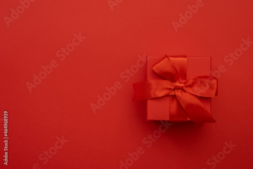 Red gift boxes with ribbons and bows on red background. Merry Christmas and Happy New Year template. Preparation for holidays. Top view. Copy space banner © 5ph