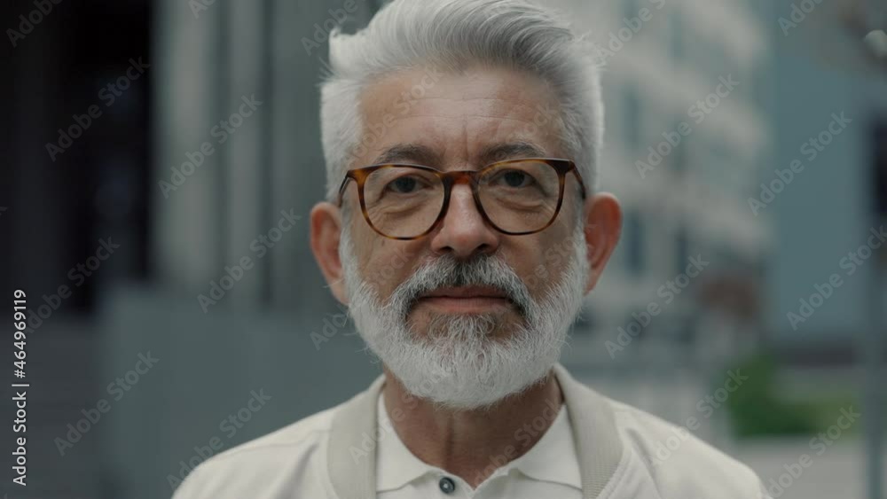 Portrait of successful senior businessman posing on street Portrait of successful senior businessman posing on street