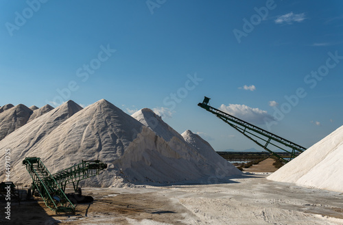 Mountains of salt in a salt factory at sunset on a sunny day. Mallorca island, Spain photo