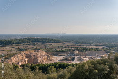 Aerial view of a stone quarry at sunset. Island of Mallorca, Spain photo