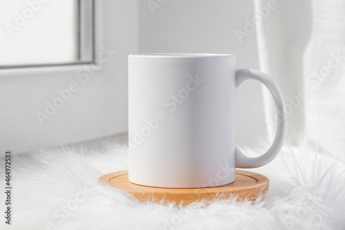 White ceramic tea cup mockup with winter concept background and copy space for your imprint. Front view 11oz mug background for winter promotional content