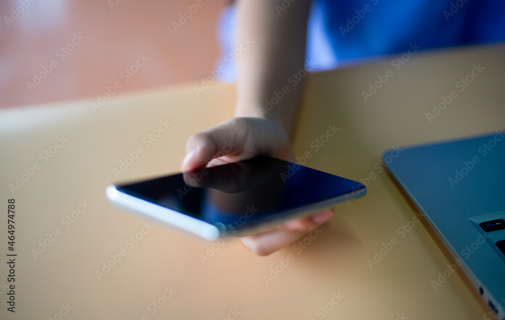close-up photo of right hand holding a smartphone close-up photo of right hand holding a smartphone