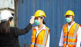 Worker measures temperature staff at Warehouse Pier.