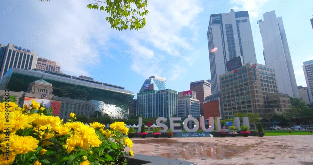I.SEOUL.U Sign Sculptures At Seoul Plaza With High-rise Buildings In Background On A Sunny Day In Seoul, South Korea. - slider shot