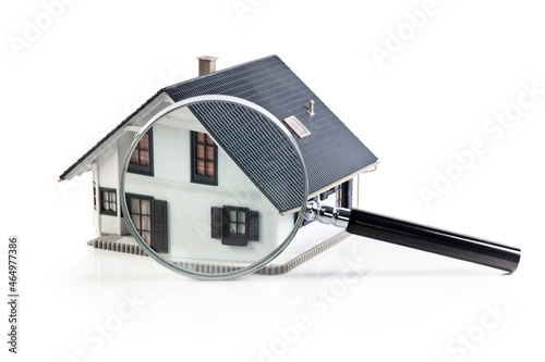 Photographie House model with magnifying glass home inspection or searching for a house