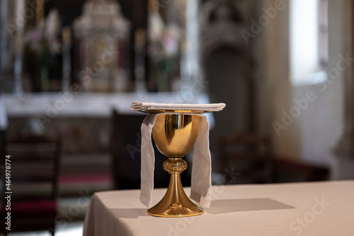 Ancient golden saint grail in catholic church photo