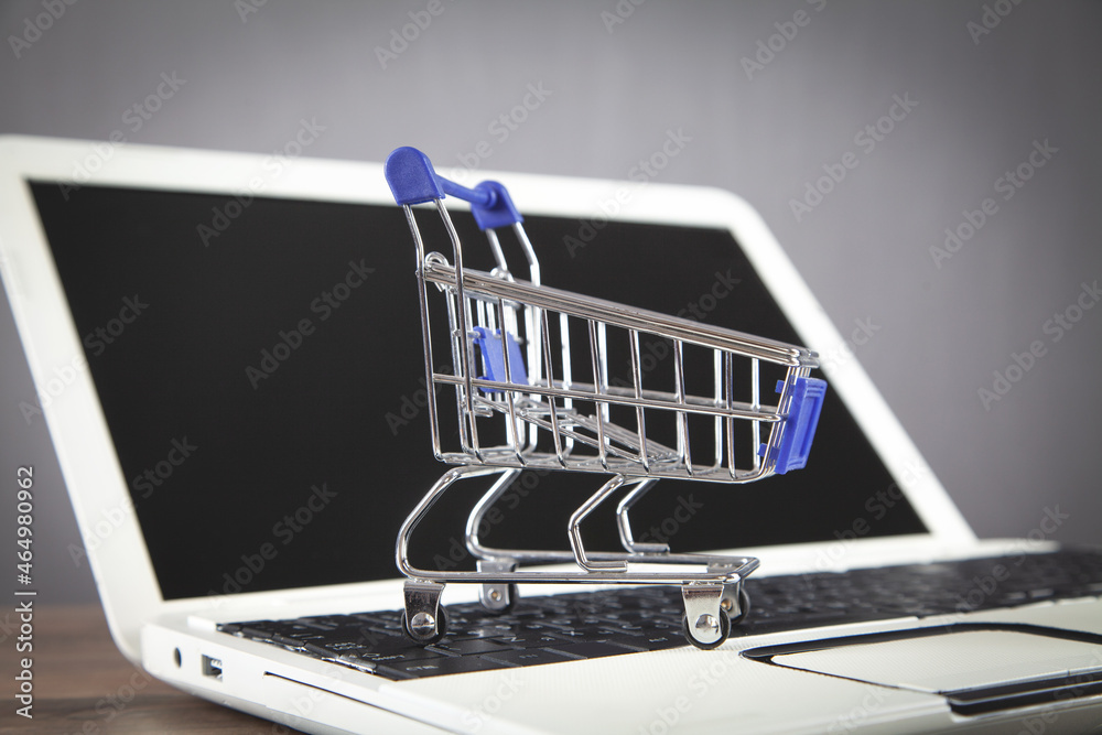 Shopping cart on the laptop keyboard.