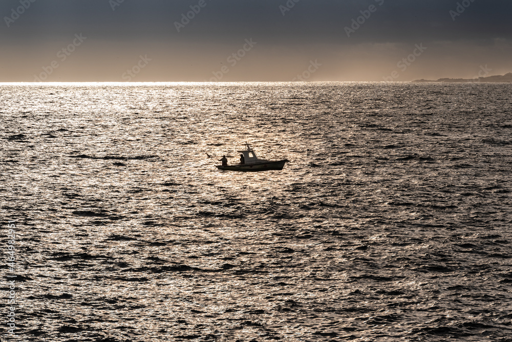Fototapeta premium fishing boat on a silver sea in spain