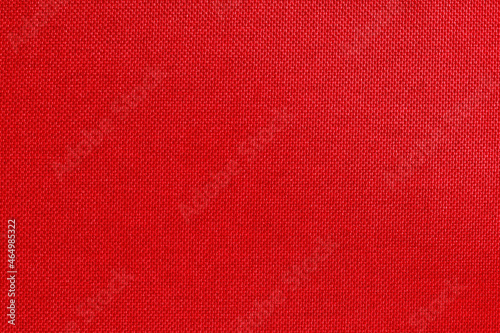 Dark red fabric cloth texture for background, natural textile seamless pattern.