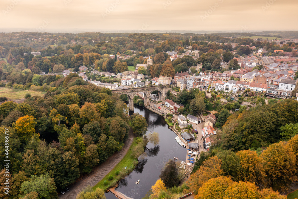 Aerial drone photo of the beautiful village of Knaresborough in North Yorkshire in the winter time showing the famous Knaresborough Viaduct and train tracks and the River Nidd