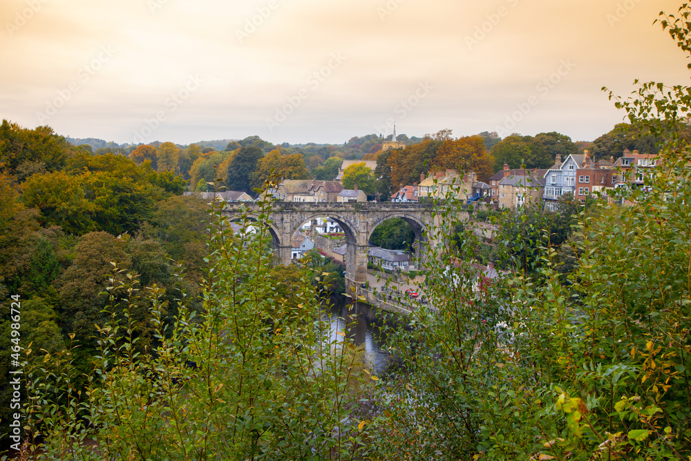 Photo of the beautiful village of Knaresborough in North Yorkshire in the winter time showing the famous Knaresborough Viaduct that goes over the River Nidd